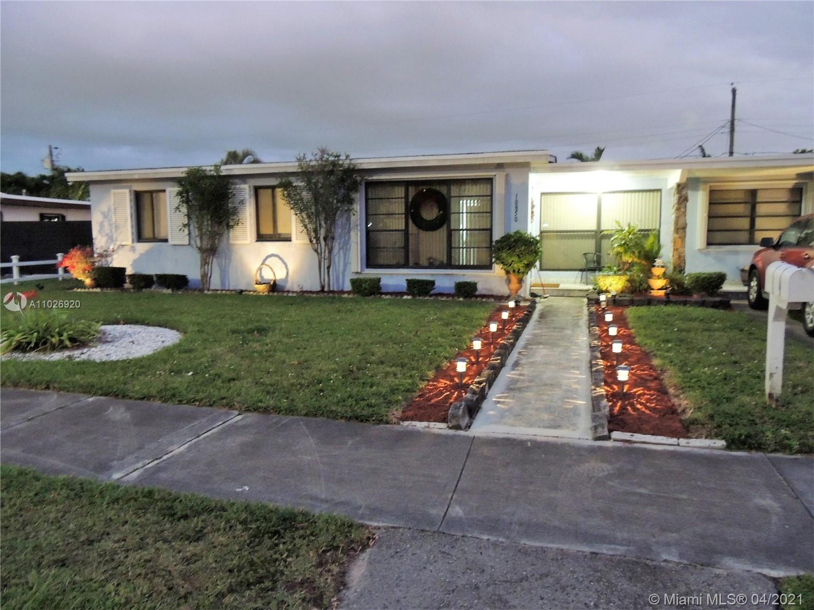 Westwood Lakes Miami, FL 33165 - Photo 2 of 29 a front view of a house with yard