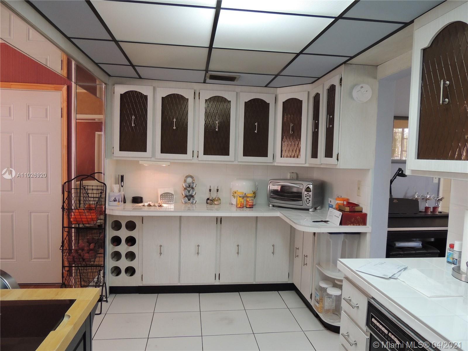 Westwood Lakes Miami, FL 33165 - Photo 11 of 29 a kitchen with stainless steel appliances a sink and cabinets