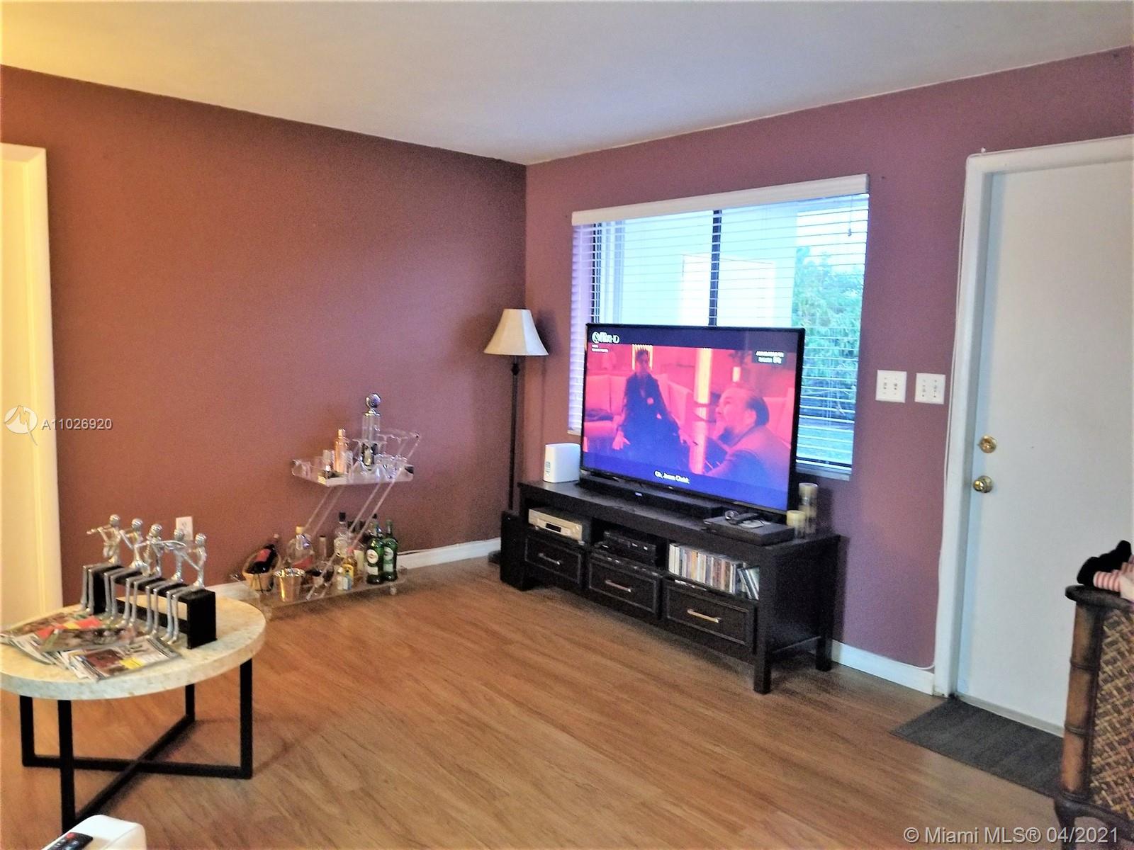 Westwood Lakes Miami, FL 33165 - Photo 15 of 29 a living room with furniture and a flat screen tv