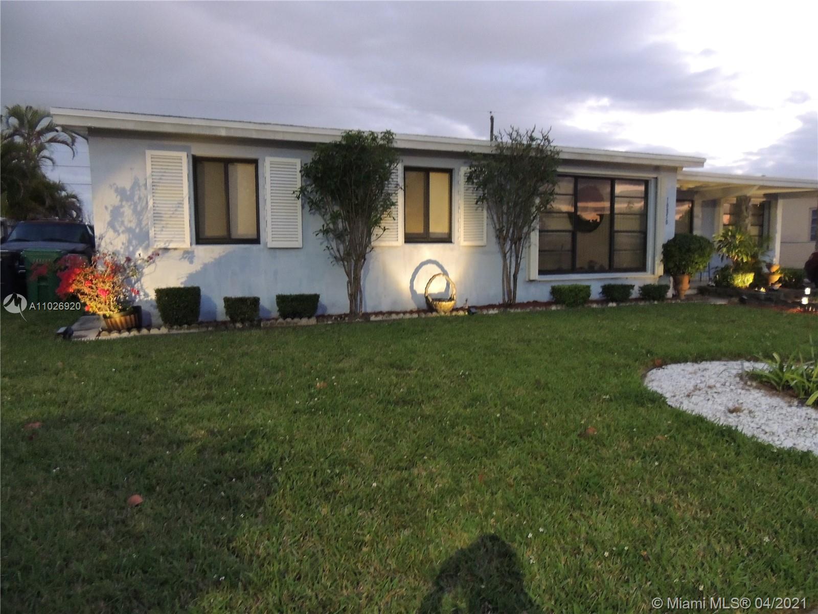 Westwood Lakes Miami, FL 33165 - Photo 3 of 29 a front view of house with yard and green space
