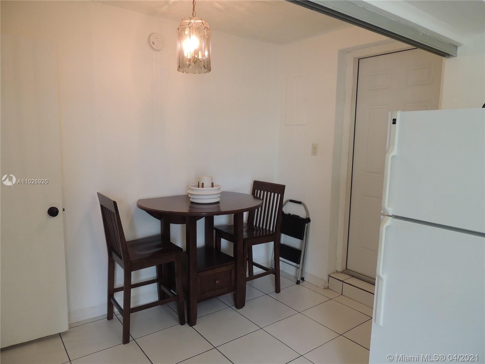 Westwood Lakes Miami, FL 33165 - Photo 22 of 29 a view of a dining room with furniture