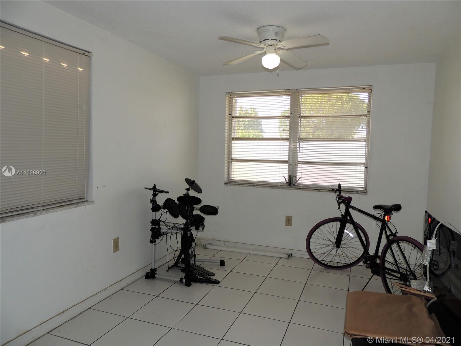 Westwood Lakes Miami, FL 33165 - Photo 24 of 29 a view of a workspace with furniture and a window