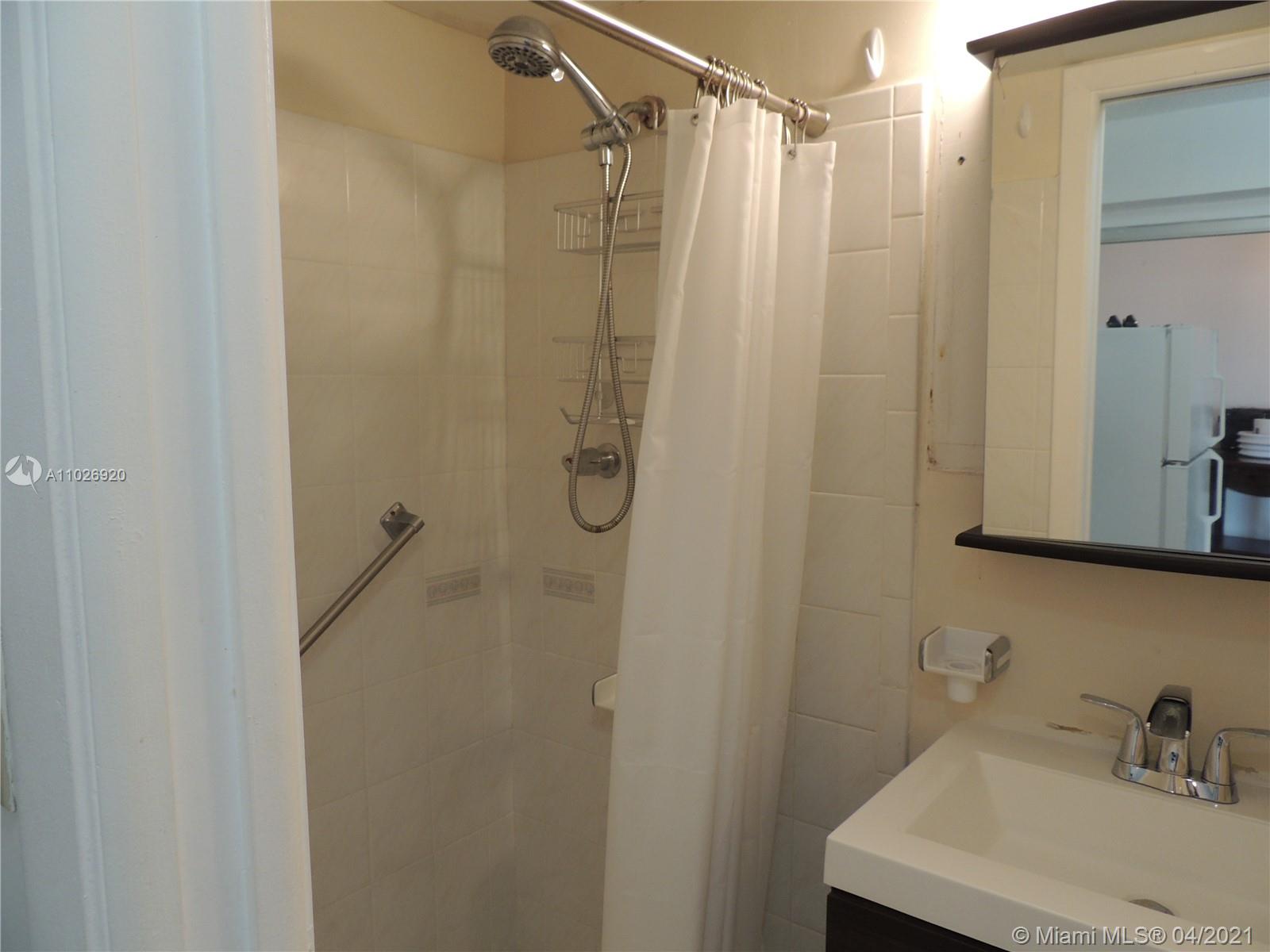 Westwood Lakes Miami, FL 33165 - Photo 26 of 29 a bathroom with a shower and a sink