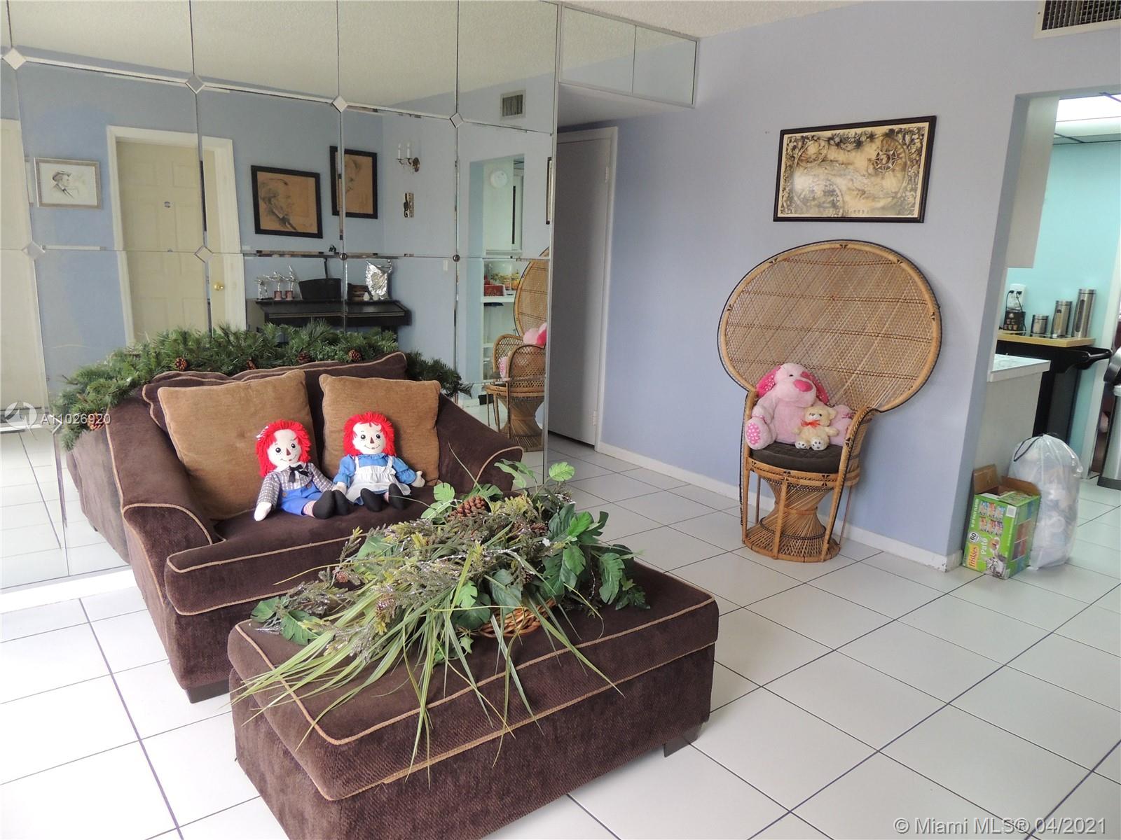 Westwood Lakes Miami, FL 33165 - Photo 4 of 29 a living room with furniture and a flat screen tv