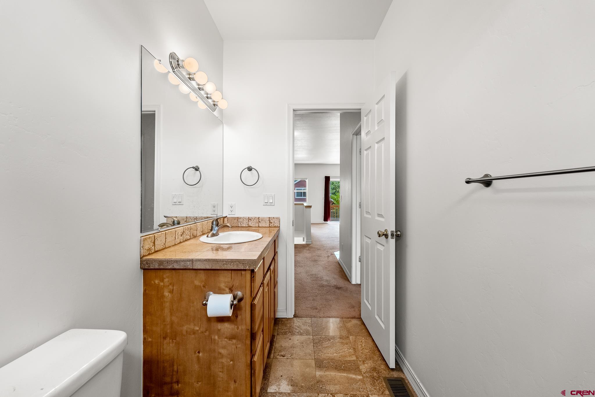 33 Cedar Ridge Way, Unit 3 Durango, CO 81301 - Photo 19 of 31 a bathroom with a sink toilet and shower