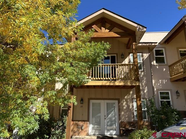 33 Cedar Ridge Way, Unit 3 Durango, CO 81301 - Photo 2 of 31 a view of a house with brick walls and flower plants