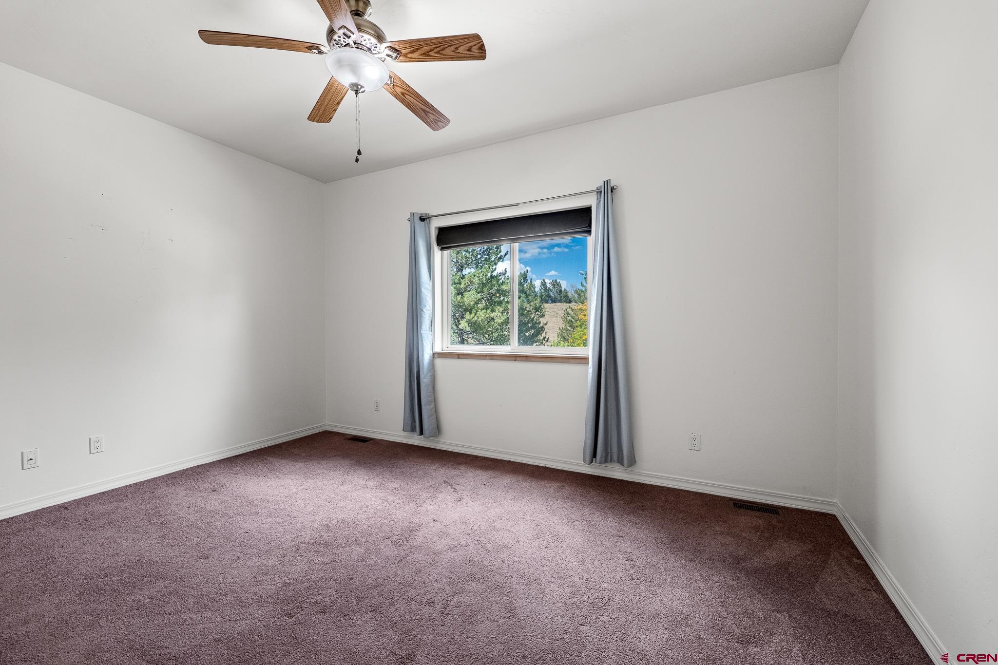 33 Cedar Ridge Way, Unit 3 Durango, CO 81301 - Photo 23 of 31 a view of room with window and ceiling fan
