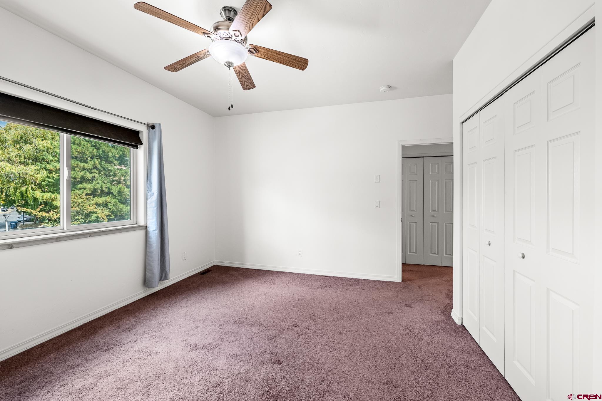 33 Cedar Ridge Way, Unit 3 Durango, CO 81301 - Photo 24 of 31 a view of a livingroom with a ceiling fan and window