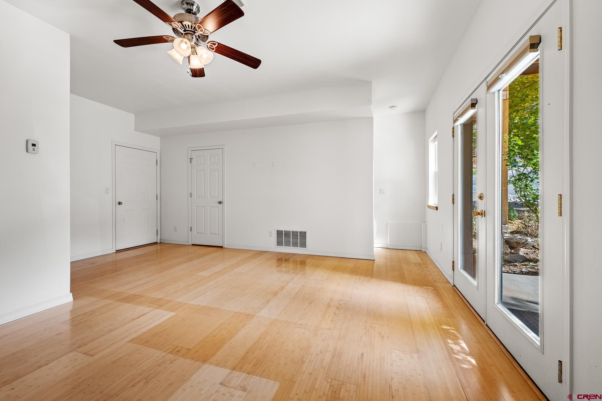 33 Cedar Ridge Way, Unit 3 Durango, CO 81301 - Photo 27 of 31 a view of an empty room and chandelier fan