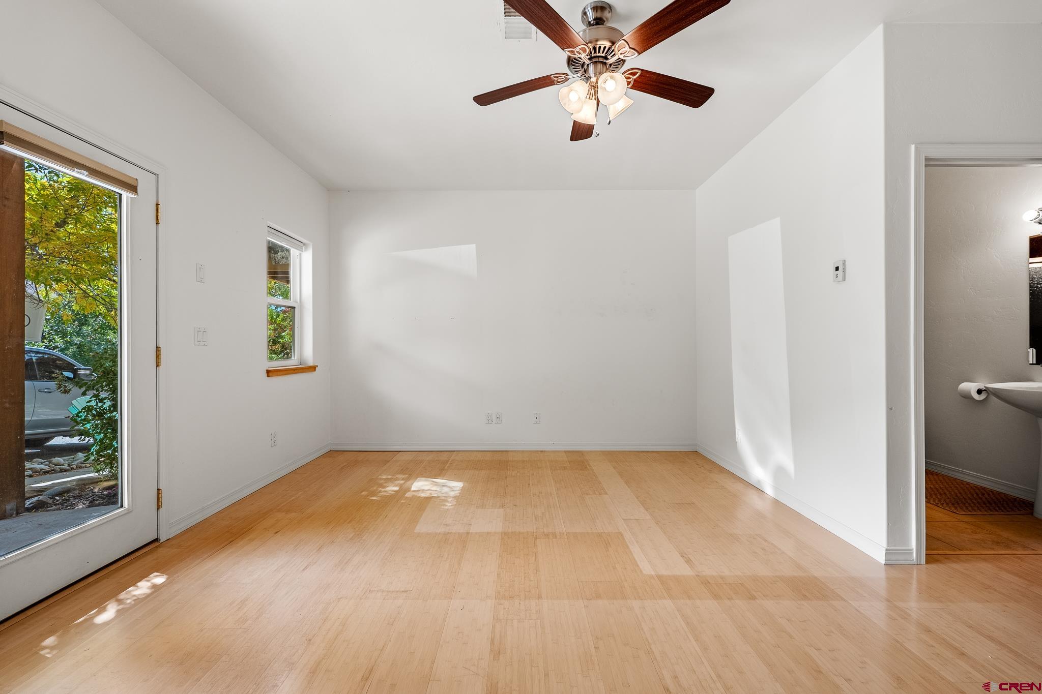 33 Cedar Ridge Way, Unit 3 Durango, CO 81301 - Photo 28 of 31 an empty room with windows and fan