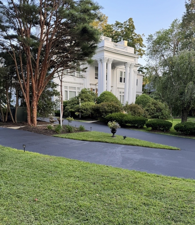 600 Washington Street, Unit 7 Wellesley, MA 02482 - Photo 1 of 13 a house view with a garden space