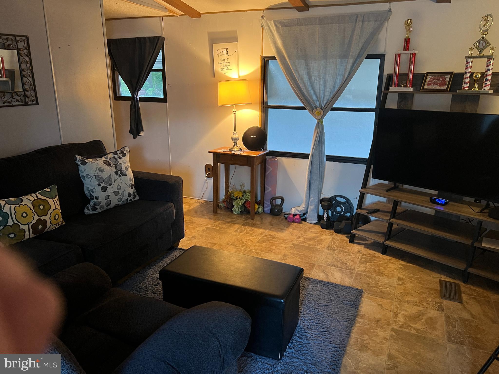 576 West Forest Grove Road Vineland, NJ 08360 - Photo 2 of 14 a living room with furniture and a flat screen tv