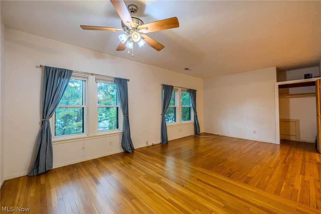 2472 Overlook Road Cleveland Heights, OH 44106 - Photo 11 of 30 Unfurnished bedroom with light wood flooring, ceiling fan, and a closet
