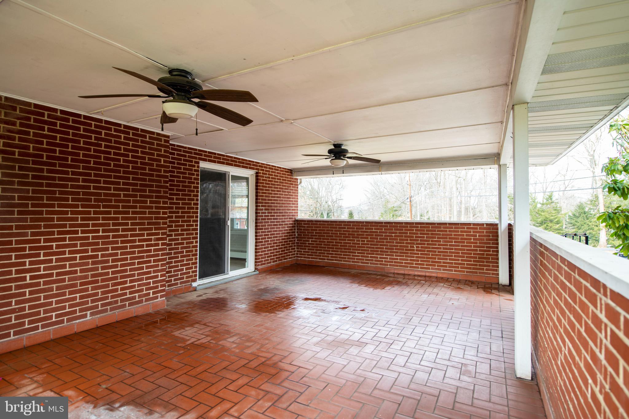 300 Plumtree Road Bel Air, MD 21015 - Photo 20 of 60 Side porch off of DR w ceiling fans and brick floo