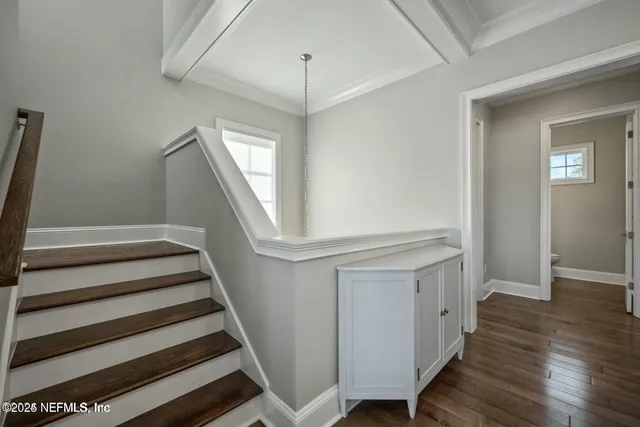 a living room with furniture and flowers