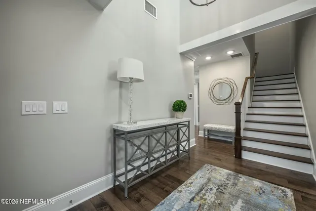 a bathroom with a shower and a glass door