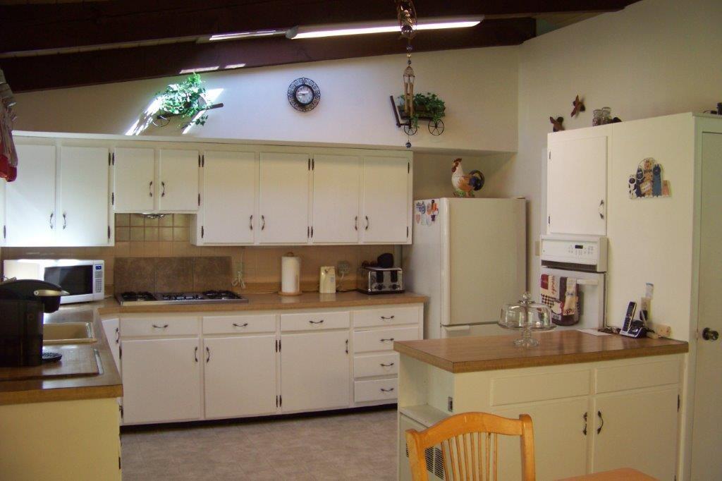 5 Green Street Springvale, ME 04083 - Photo 16 of 34 Kitchen w/ cathedral ceiling and...