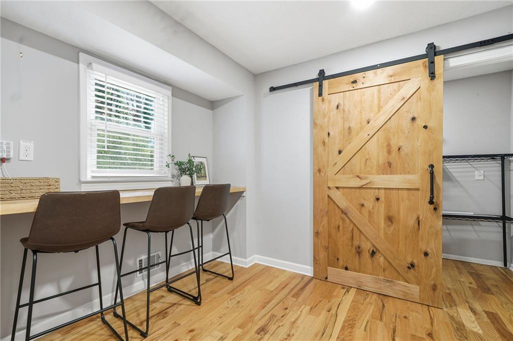 111 John Christopher Drive Alpharetta, GA 30009 - Photo 13 of 30 a dining room with wooden floor and a table