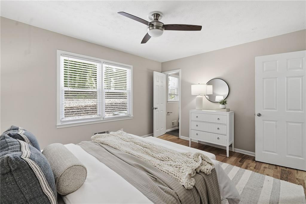 111 John Christopher Drive Alpharetta, GA 30009 - Photo 17 of 30 a bedroom with a bed and a dresser