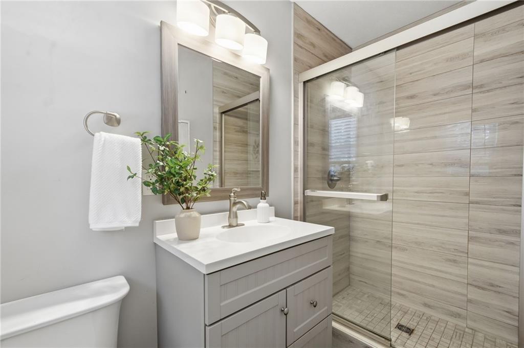 111 John Christopher Drive Alpharetta, GA 30009 - Photo 18 of 30 a bathroom with a sink toilet and shower
