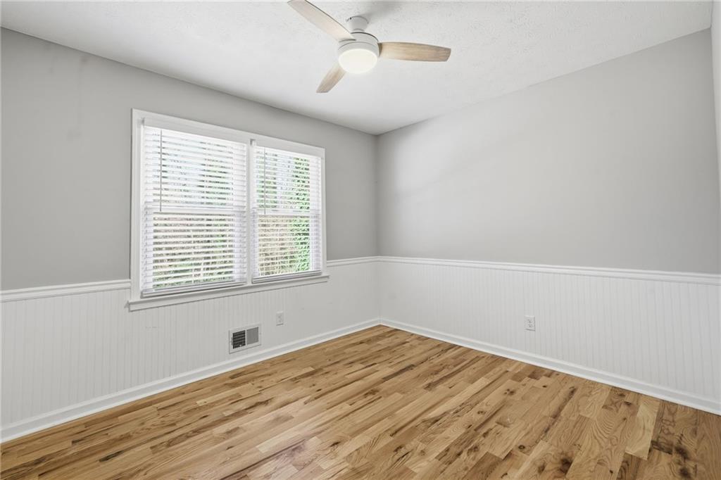 111 John Christopher Drive Alpharetta, GA 30009 - Photo 19 of 30 a view of a room with wooden floor and windows
