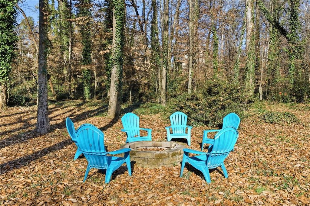 111 John Christopher Drive Alpharetta, GA 30009 - Photo 27 of 30 a view of a yard with sitting area and furniture