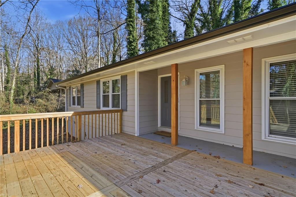 111 John Christopher Drive Alpharetta, GA 30009 - Photo 3 of 30 a view of backyard with deck and outdoor seating