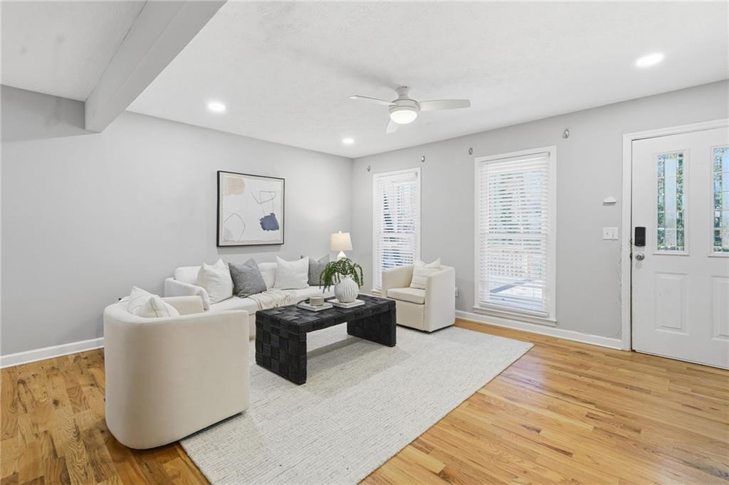 111 John Christopher Drive Alpharetta, GA 30009 - Photo 7 of 30 a living room with furniture and wooden floor