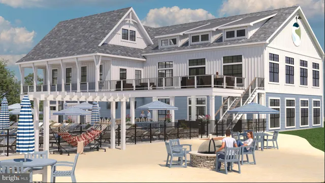 a front view of a building with outdoor seating