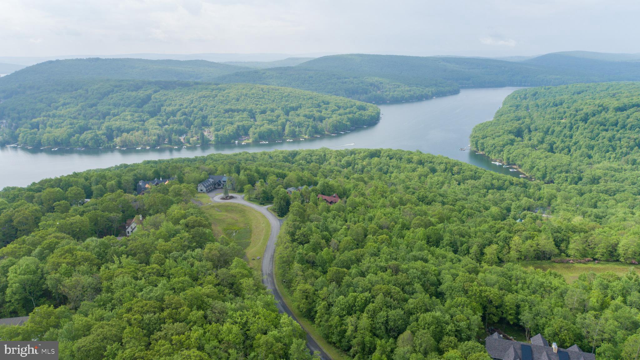 Lot 47 Mountaintop Road McHenry, MD 21541 - Photo 8 of 26 an aerial view of a house with a lush green forest