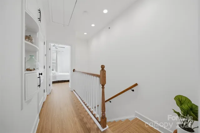 a view of a hallway with a white walls