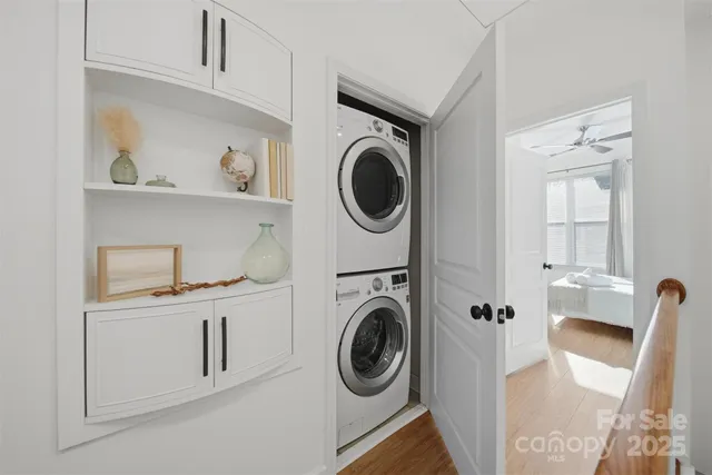 a utility room with sink dryer and washer