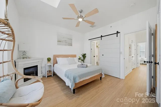 a bedroom with a bed and a fireplace