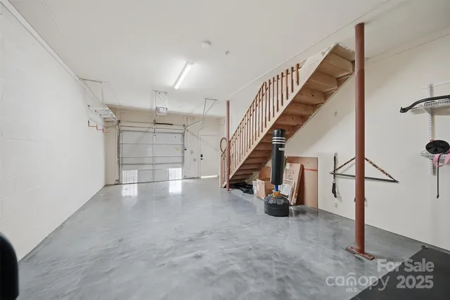 a view of an empty room with stairs