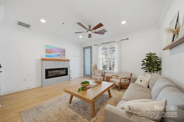 a living room with furniture and a fireplace