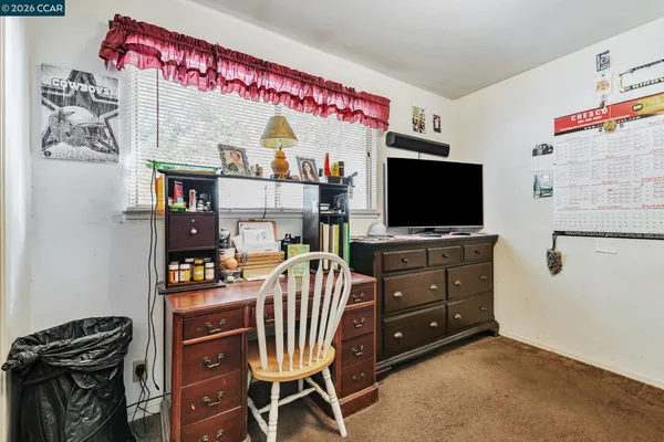 a room with furniture and a flat screen tv