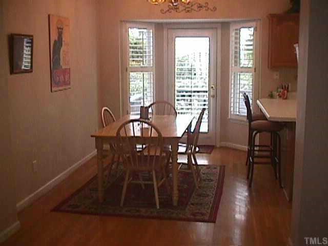 4831 Altha Street Raleigh, NC 27606 - Photo 3 of 9 a view of a dining room with furniture window and wooden floor