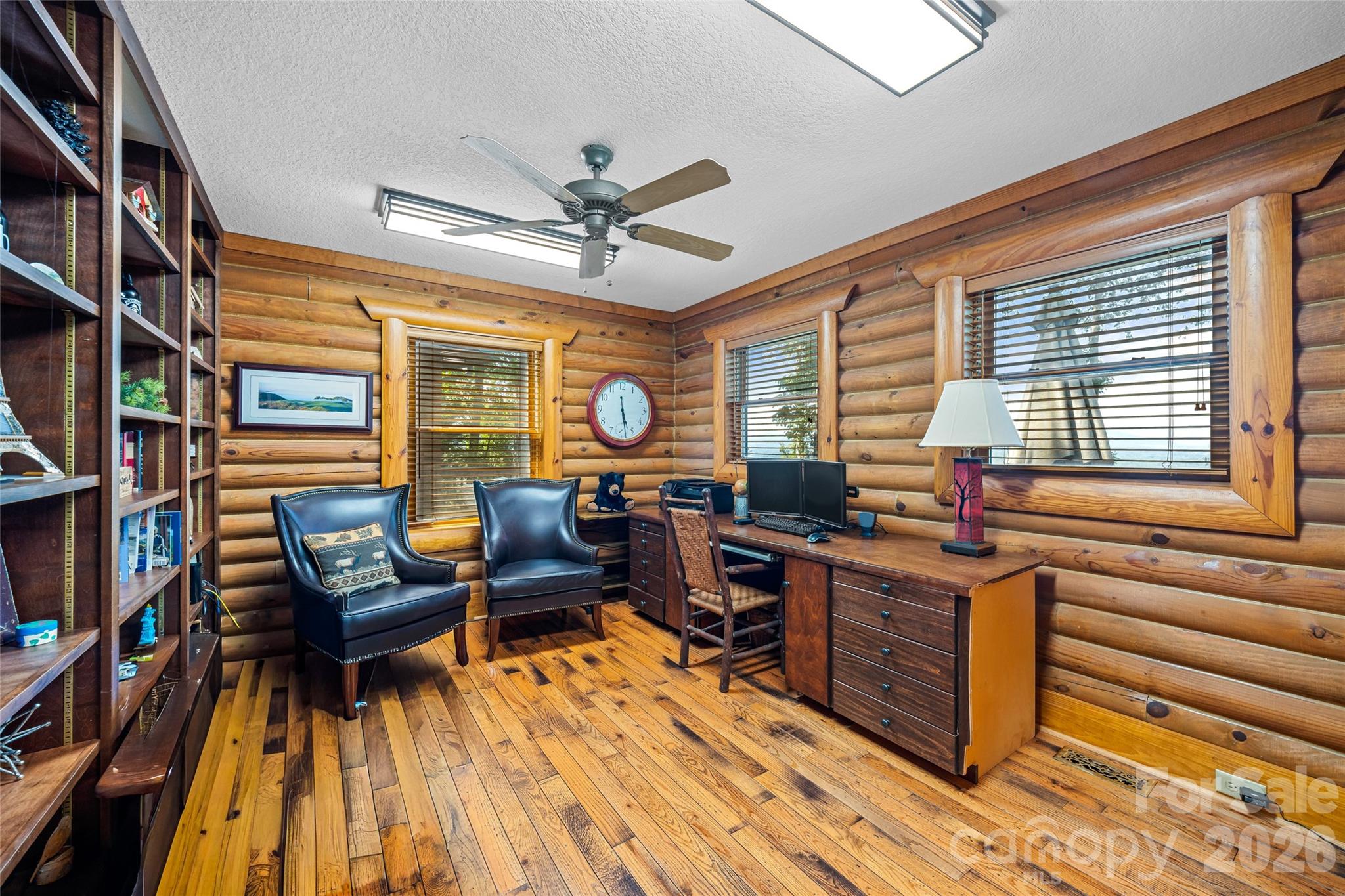 82 Running Ridge Road Asheville, NC 28804 - Photo 12 of 45 a view of a workspace with furniture and a window