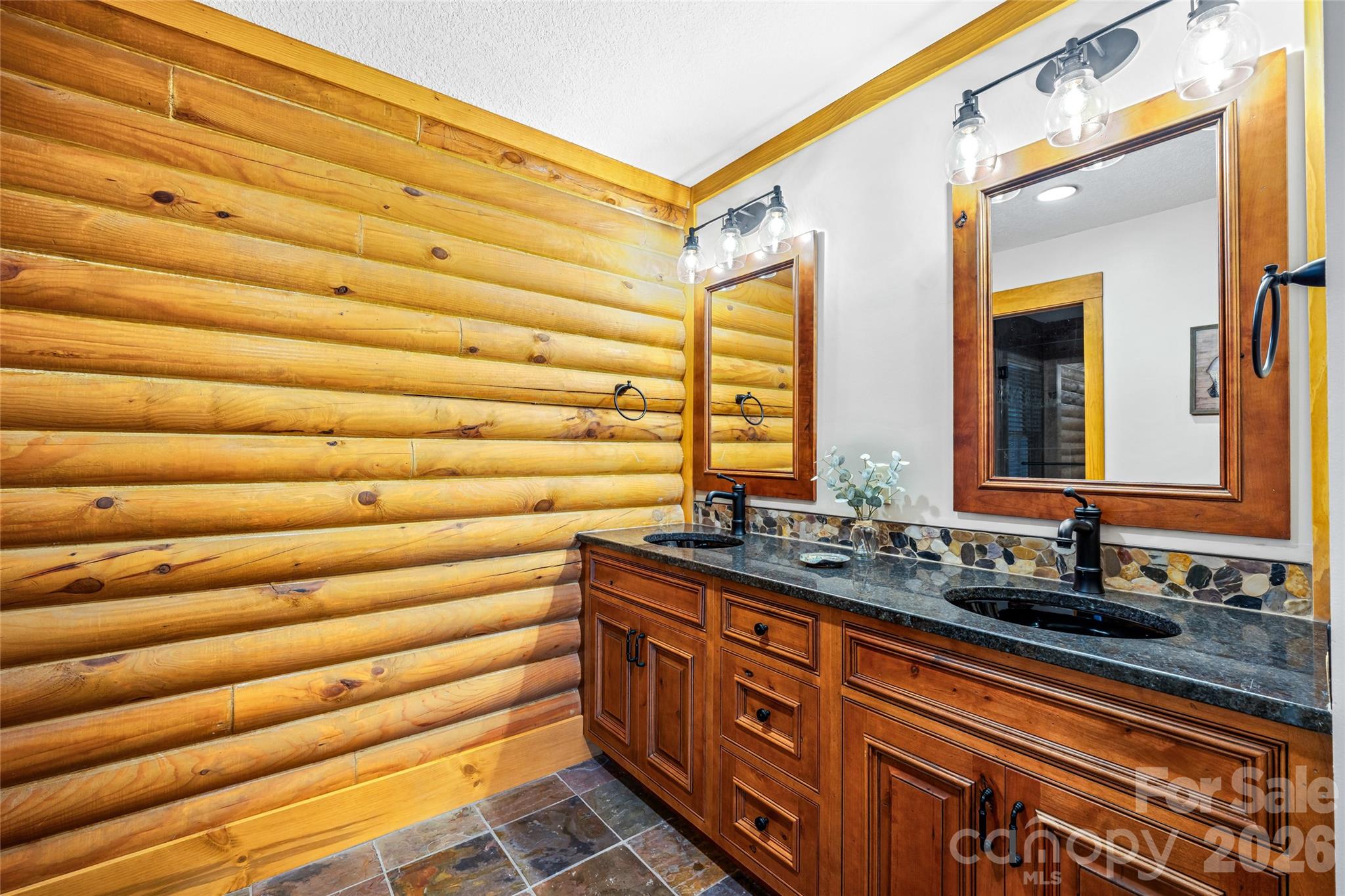 82 Running Ridge Road Asheville, NC 28804 - Photo 19 of 45 a bathroom with a sink and a mirror