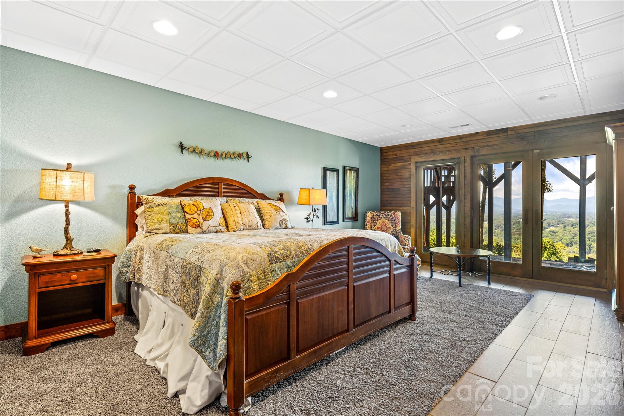 82 Running Ridge Road Asheville, NC 28804 - Photo 24 of 45 a bedroom with a large bed and a night stand