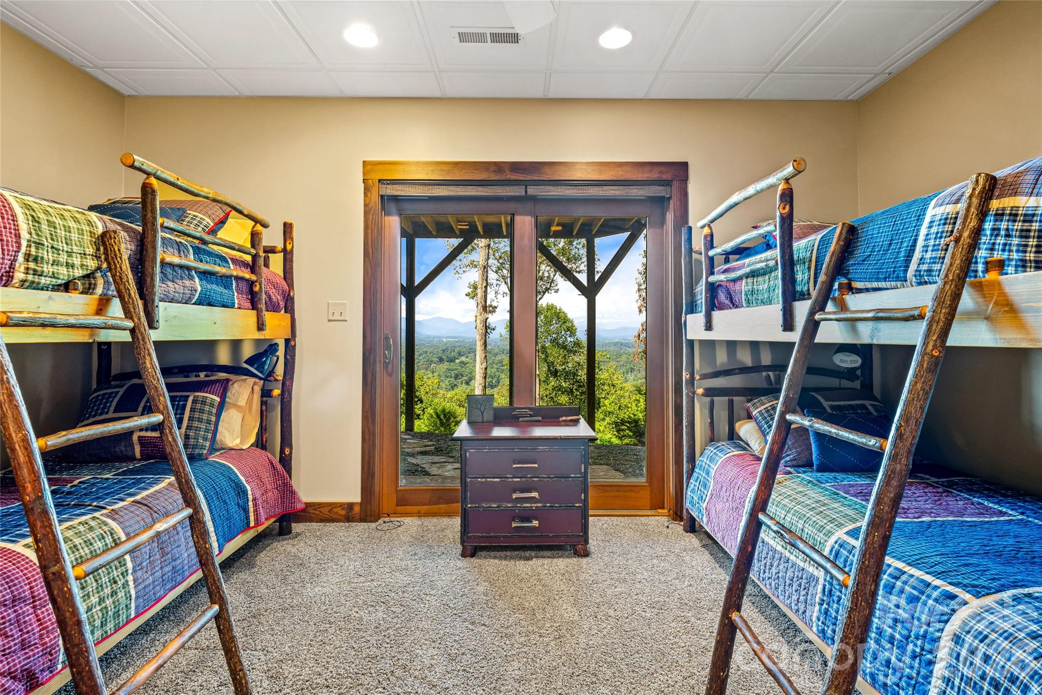 82 Running Ridge Road Asheville, NC 28804 - Photo 27 of 45 a living room with lots of furniture and a book shelf