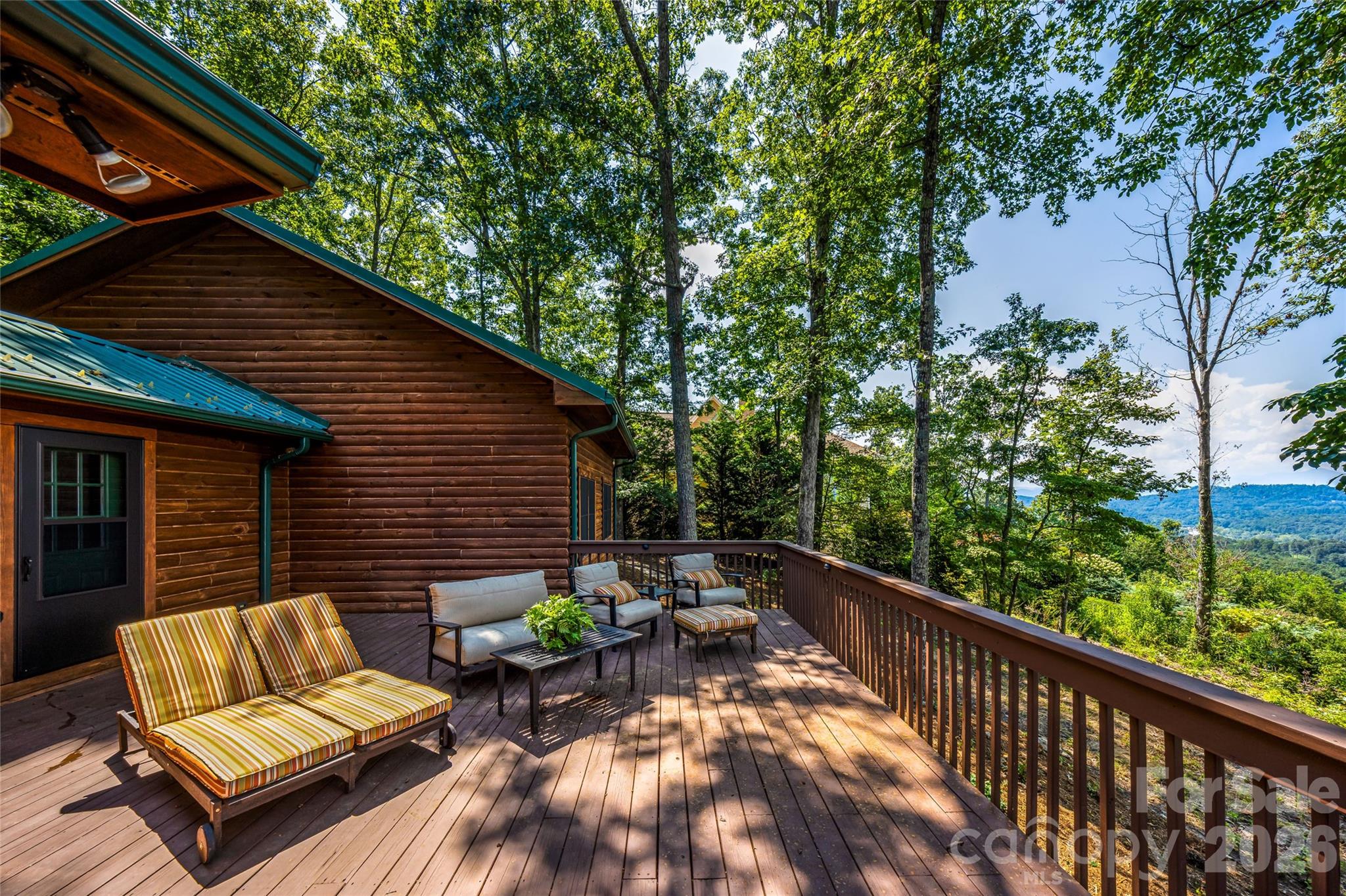 82 Running Ridge Road Asheville, NC 28804 - Photo 34 of 45 a backyard of a house with seating space