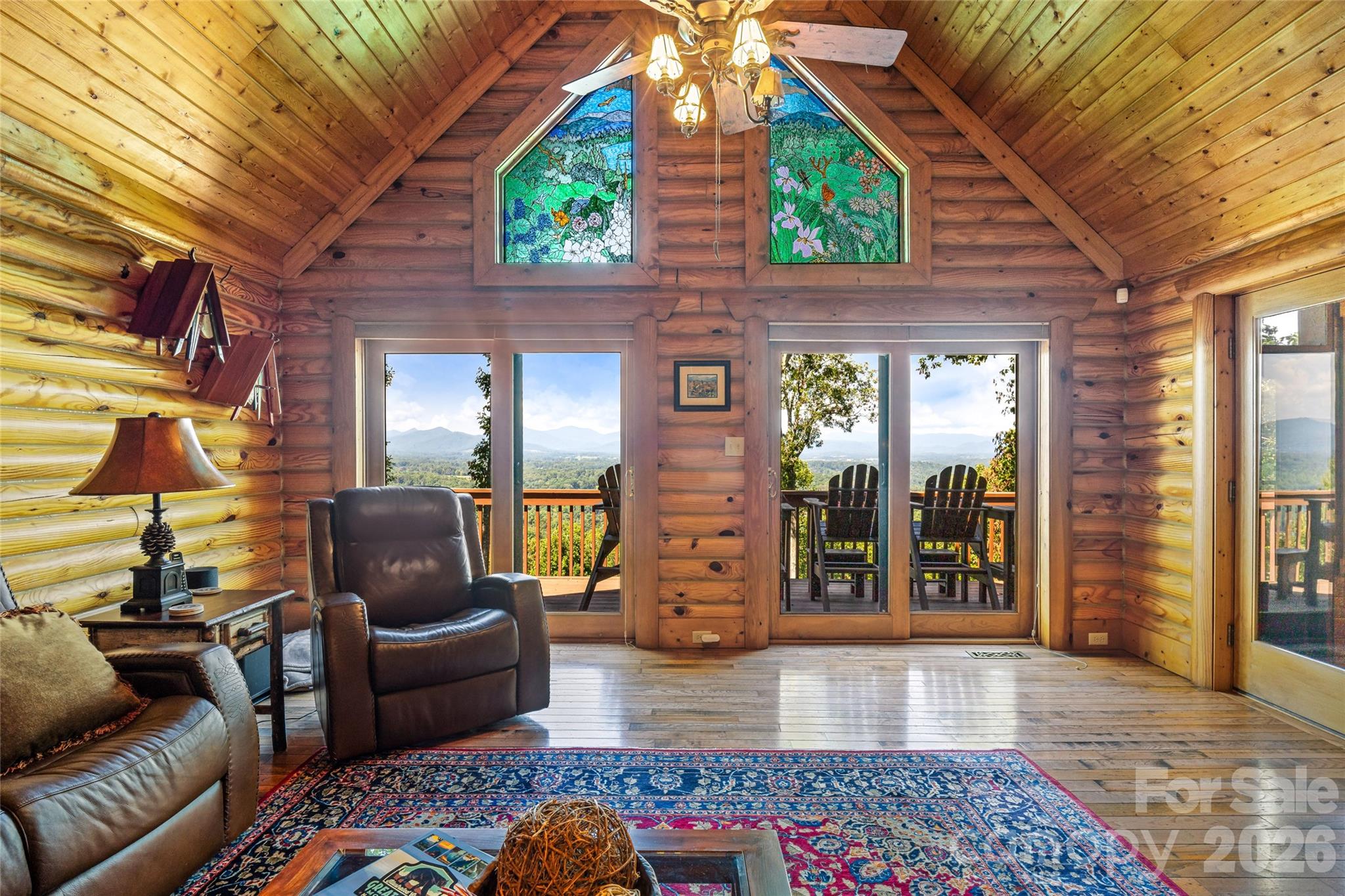 82 Running Ridge Road Asheville, NC 28804 - Photo 4 of 45 a balcony with furniture and a potted plant