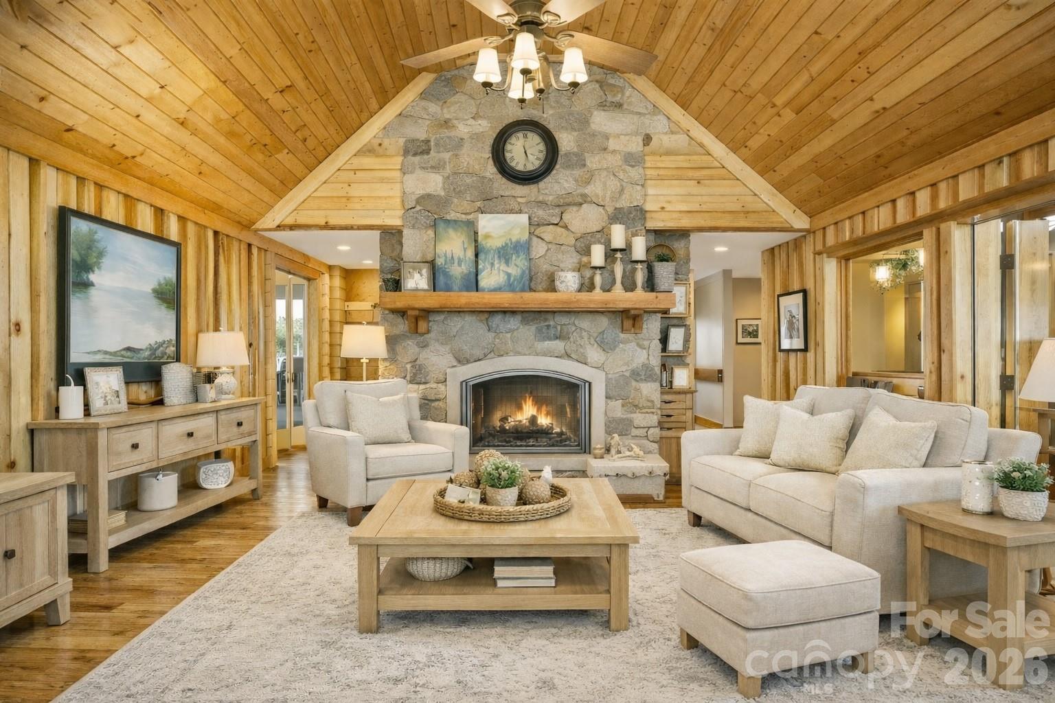 82 Running Ridge Road Asheville, NC 28804 - Photo 44 of 45 a living room with furniture a fireplace and a chandelier