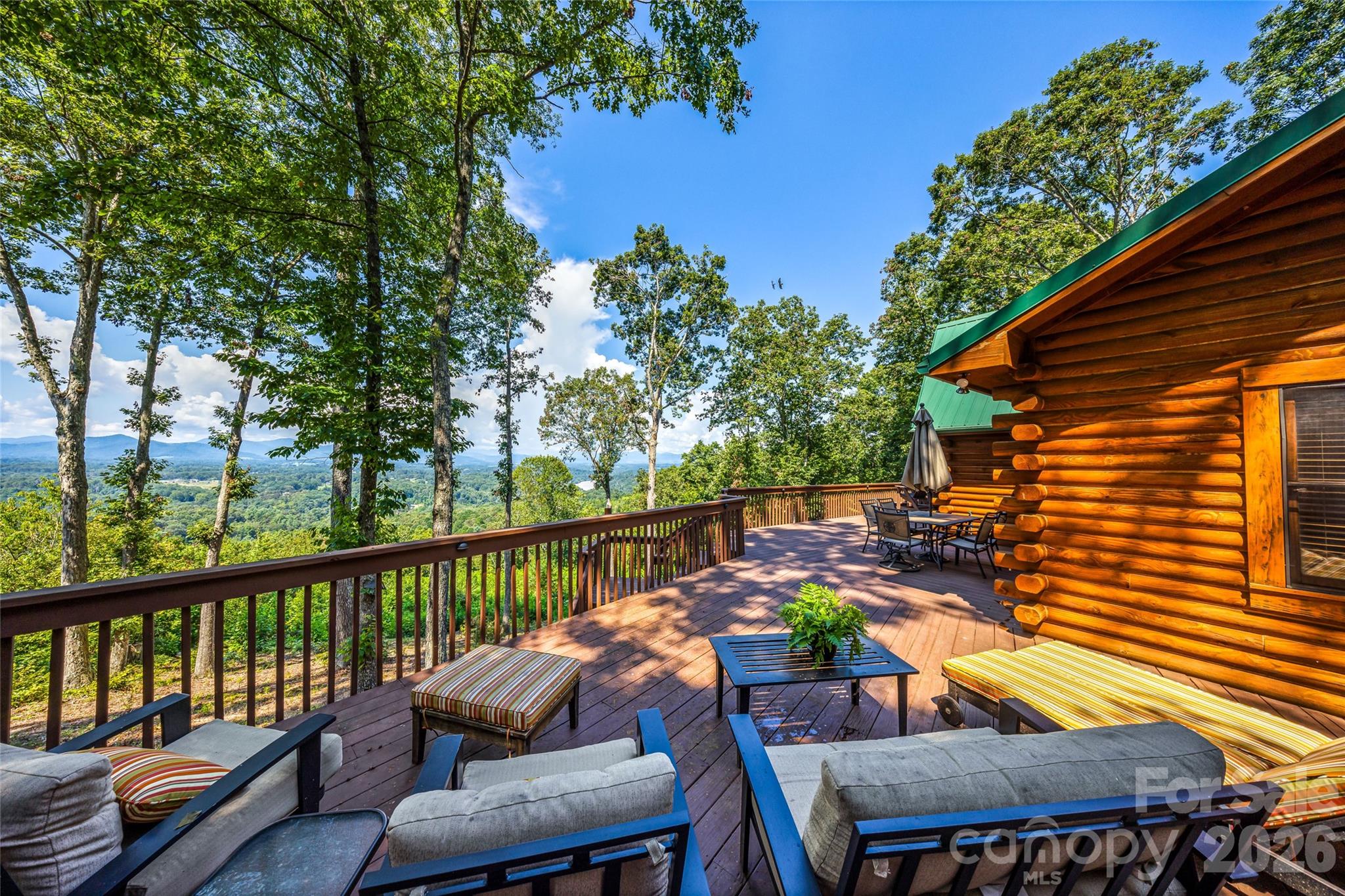82 Running Ridge Road Asheville, NC 28804 - Photo 6 of 45 a view of a chairs and table in the balcony