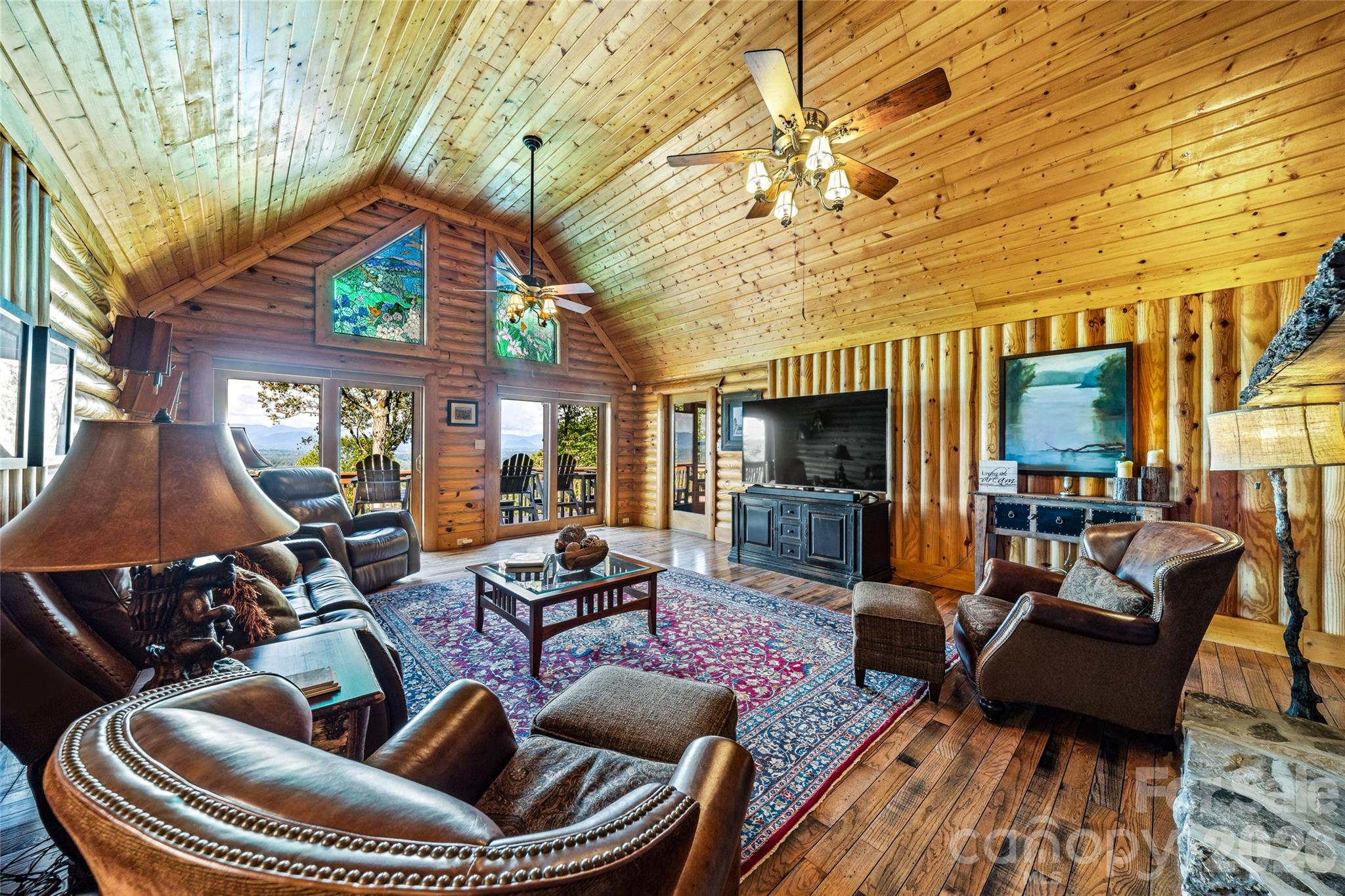 82 Running Ridge Road Asheville, NC 28804 - Photo 8 of 45 a living room with furniture a fireplace and a flat screen tv