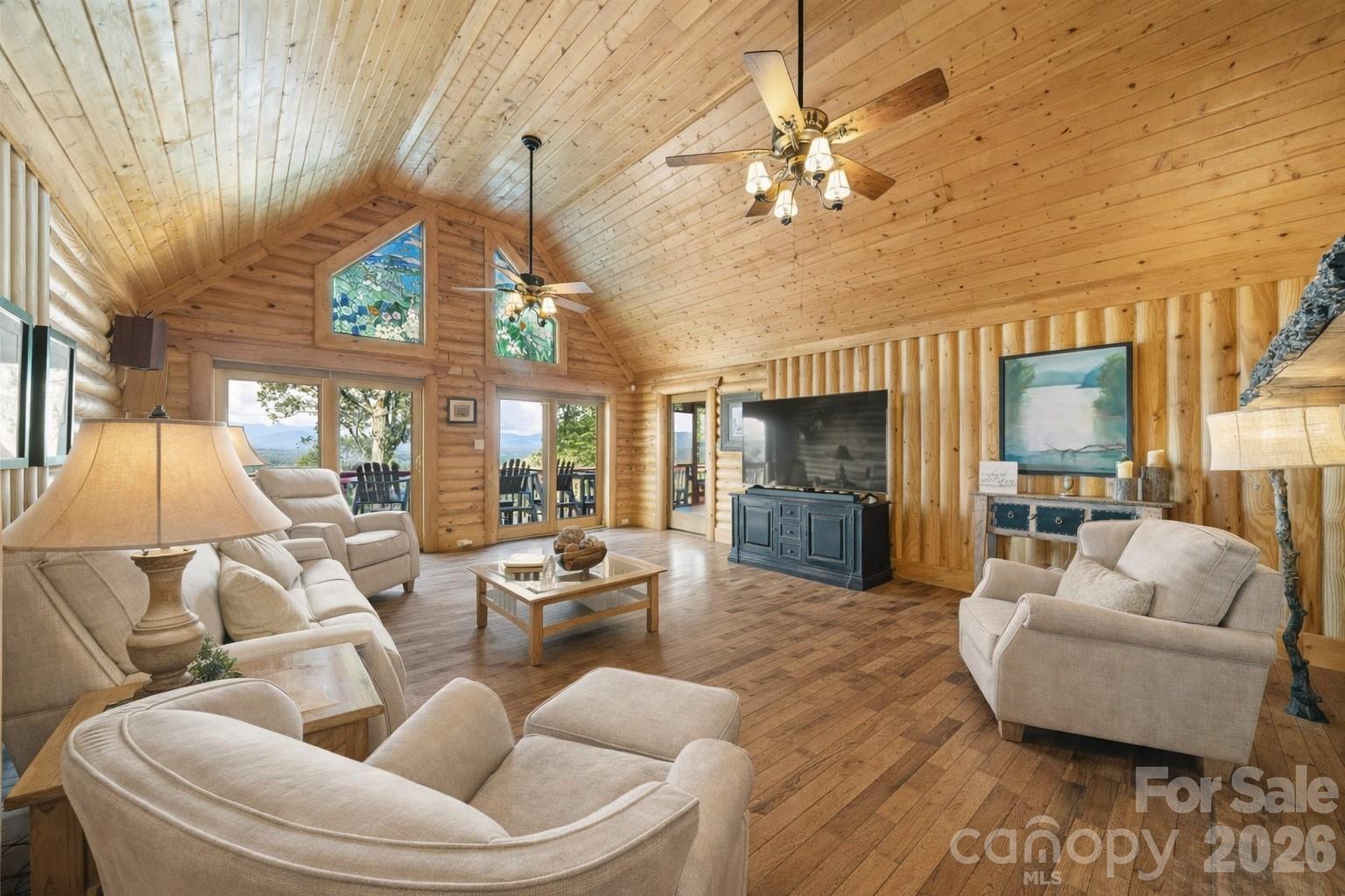 82 Running Ridge Road Asheville, NC 28804 - Photo 9 of 45 a living room with furniture and a chandelier