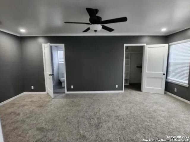 a view of an empty room with a chandelier