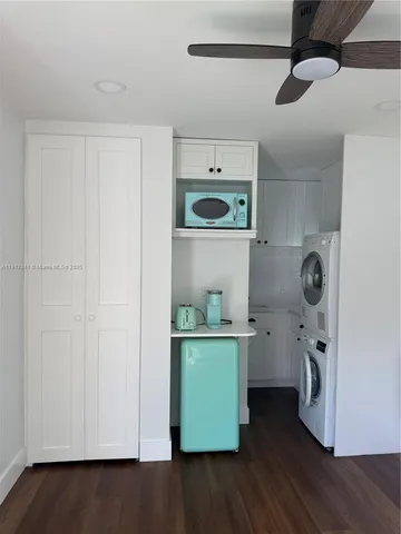 a view of cabinets and wooden floor