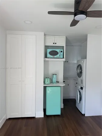 a view of cabinets and wooden floor
